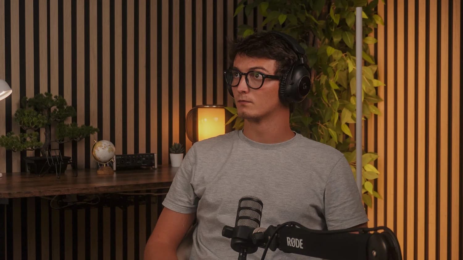 A person recording at Studio 54 in front of a Rode PodMic microphone.